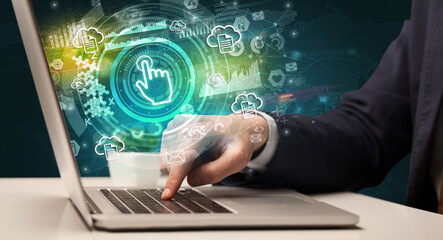 Business hand typing on a modern laptop