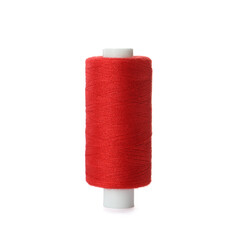 Spool of red sewing thread isolated on white