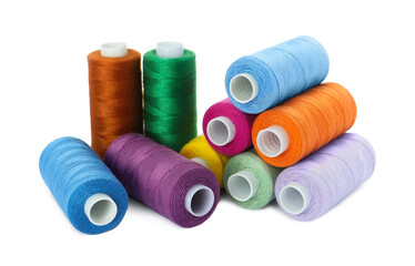 Set of different colorful sewing threads on white background