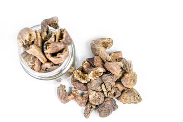 Pile of Organic Chebulic Myrobalan or Choti Harad or Terminalia chebula isolated on white background