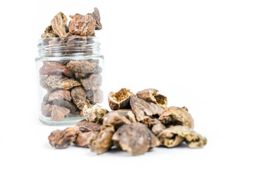 Pile of Organic Chebulic Myrobalan or Choti Harad or Terminalia chebula isolated on white background