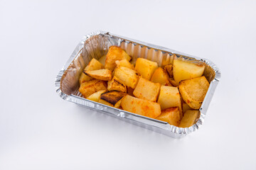 Baked potatoes served in aluminium tray