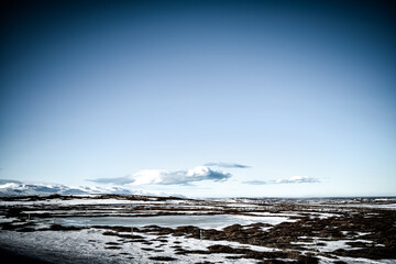landscape with snow covered mountains and lake in Iceland