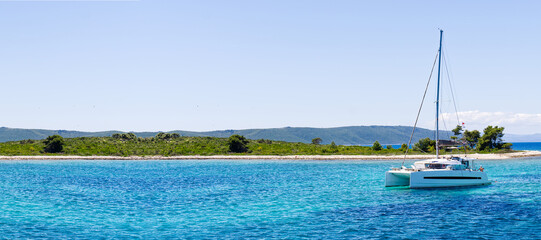 Catamaran sailing in ocean. paradise at sea. Blue sky and turquoise blue sea water. Mexican...