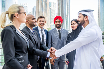 Fototapeta premium Multiracial corporare business team meeting for a deal in Dubai - Multicultural business people having a business meeting