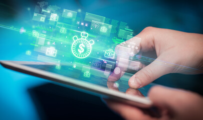 Close-up of a hand using tablet, currency concept