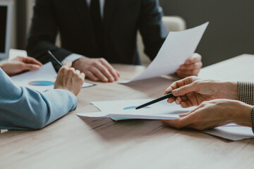 Group of multiethnic businesspeople sitting at computer desk in the office