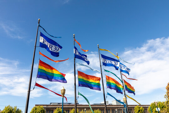 flag of pier 39 and the rainbow flag for gay people fluttering in the wind