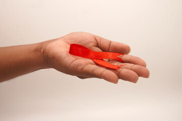 World aids day, red silk ribbon symbol of AIDS Awarenesss