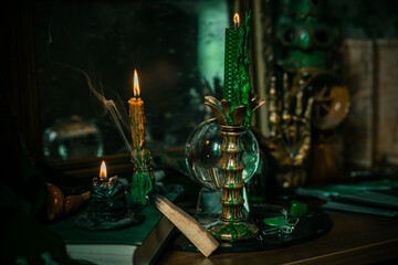 Candle burns on the altar, powerful magic among candles, energy cleaning and wicca concept	