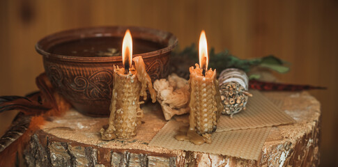 Candle burns on the altar, powerful magic among candles, energy cleaning and wicca concept	