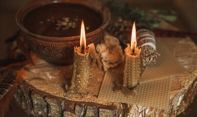Candle burns on the altar, powerful magic among candles, energy cleaning and wicca concept	