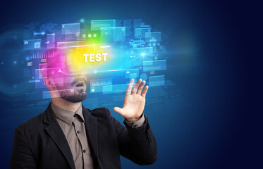 Businessman looking through Virtual Reality glasses