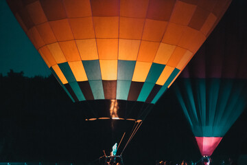 hot air balloons flying at night