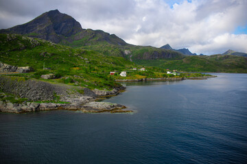  Mighty mountain ridges rising from the Arctic Sea. Lofoten impressive landscape. 