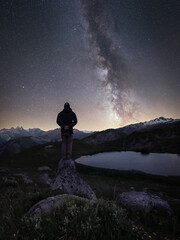 Milky way above a moutain lake. Mirror reflection of the milky way