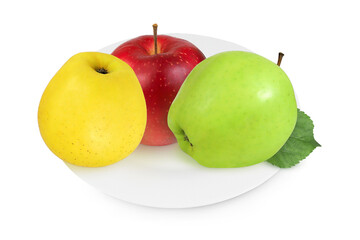 Yellow, red and green apple on a white plate on an isolated white background.