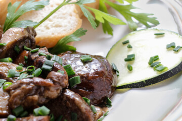 Roasted mushrooms with vegetables and bread.