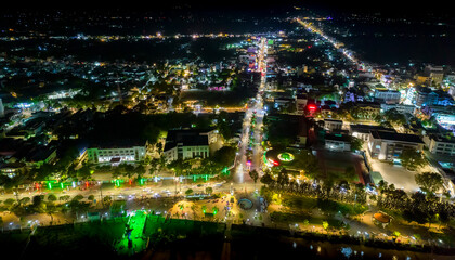 Chau Doc city, An Giang, Vietnam at night, aerial view. This is a large city in Mekong Delta, developing infrastructure, population, and agricultural product trading center in border area of Vietnam