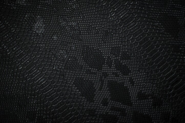 Vegan faux Snakeskin leather texture. minimalist and elegant textile. simple dark black backdrop