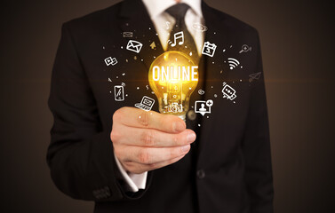 Businessman holding a light bulb, social media concept