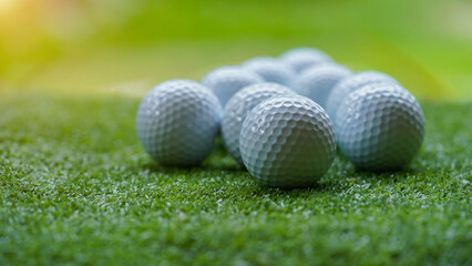 Golf ball on green grass with blur background
