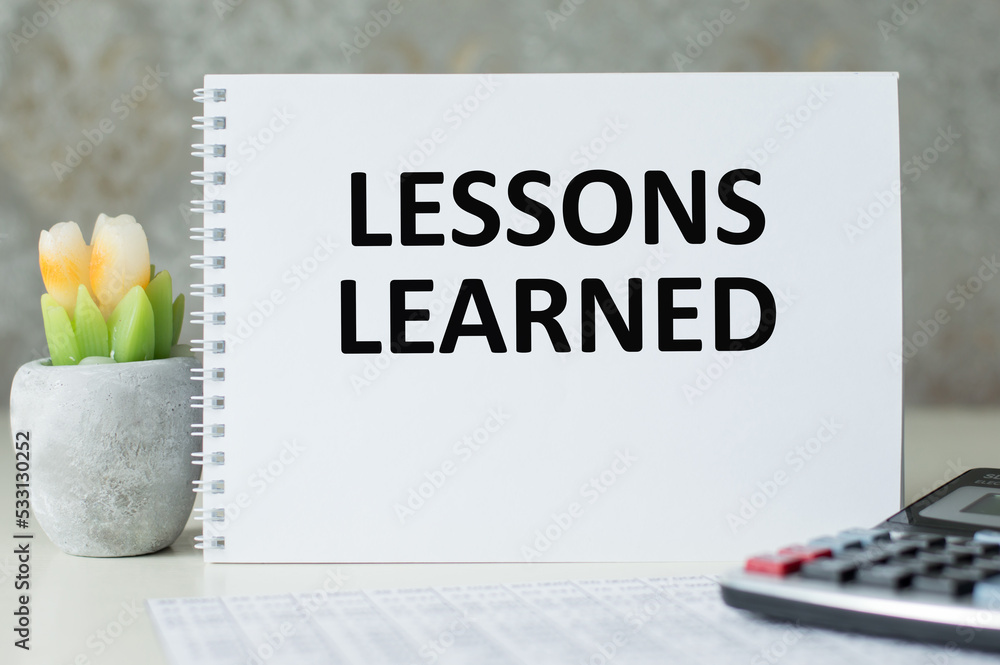 Poster a notebook with the inscription lessons learned.