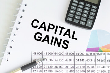 with text CAPITAL GAINS TAX, business concept image with soft focus background