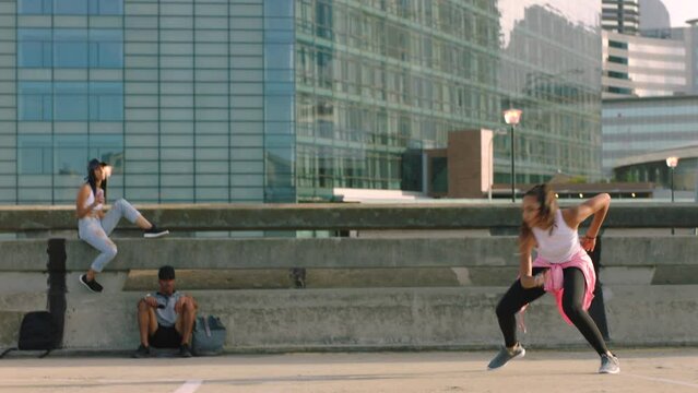 Street Dancing, Performance Team And Woman With Group Dancing In The Road, Energy With Rave Music And Friends In Collaboration For Dance In The City. Professional Dancer With Teamwork For Competition