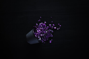 amethyst chips macro detail black background. close-up polished semi-precious gemstone copy space...