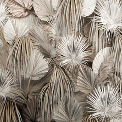  installation of a decorative wall of white dried flowers and pampas grass, reeds and a dry palm branch