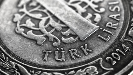 Translation: Turkish lira. Fragment of 1 lira coin close up. National currency of Turkey. Black and white illustration for news about economy or finance. Money and bank in Turkey. Macro - obrazy, fototapety, plakaty