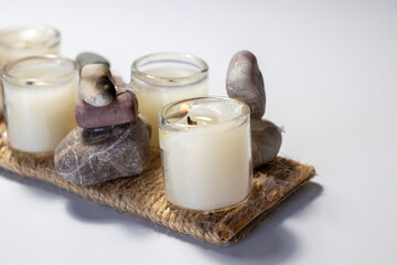 candles and natural stones isolated on white background.