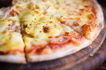 pizza hawaiian cheese on wood table. homemade food concept