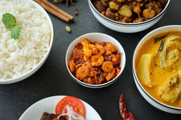 Top view spicy hot Bengali Prawn roast , shrimp masala fish curry, rice . Indian food. Fish fry red...