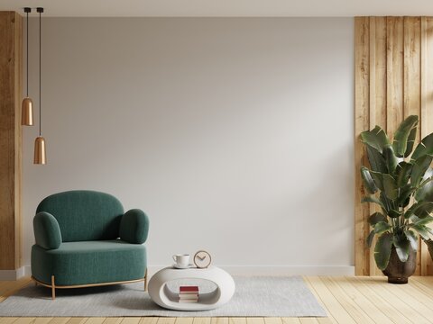 Modern interior of wall space with green armchair on empty white room.