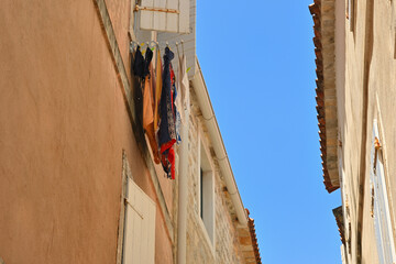 Drying clothes. Architecture of the Old Town in Budva. Montenegro