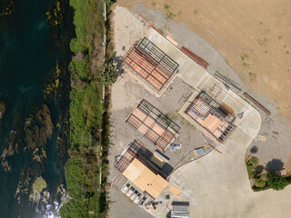 Aerial photo top to down view of tiny houses built with metal profile