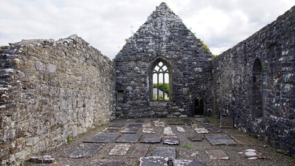 Fototapeta na wymiar Aghagower's round tower and abbey