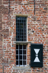 old wall with windows in the sun
