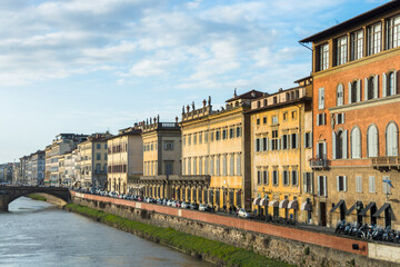 Fototapeta na wymiar The Ponte Vecchio, Old Bridge, is a Medieval stone closed-spandrel segmental arch bridge over the Arno River, with shops built along it; as jewelers, art dealers and souvenir sellers. Italy, 2019