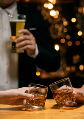 Barman pouring whiskey whiskey glass beautiful night