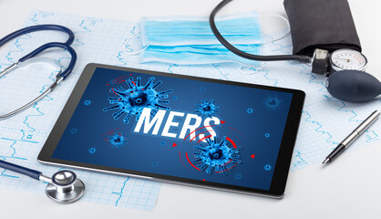 Tablet pc and doctor tools on white surface