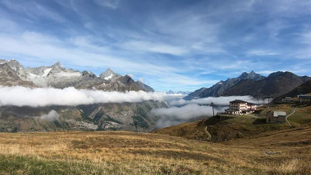 Timelapse Sea of mist at Matterhorn Mountain near Bruder Klaus, Riffelberg Chapel, Riffelsee Zermatt, Switzerland.