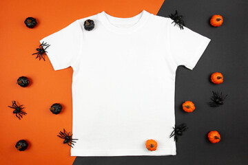 White womens cotton t-shirt halloween mockup with pumpkins and spiders on black orange background....