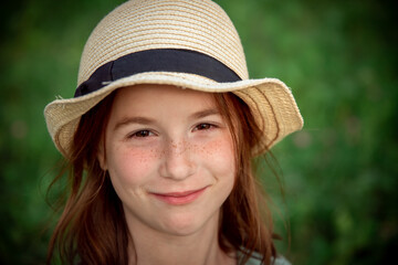 portrait of a cute girl with red hair and freckles