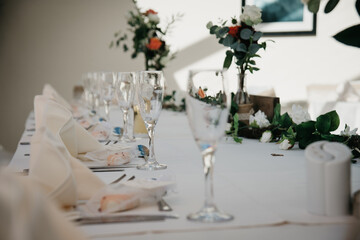 Rustic Wedding Reception Top Table seating with glasses, cutlery and dishes