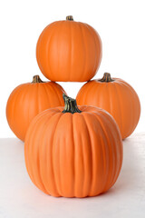 closeup fake pumpkin with pile in background