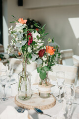Rustic Wedding Reception Top Table seating with glasses, cutlery and dishes