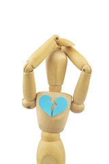 Wooden mannequin with broken heart isolated on white background. Concept of break up and divorce.